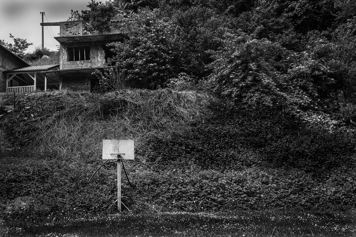 21. Basketball net and house remains