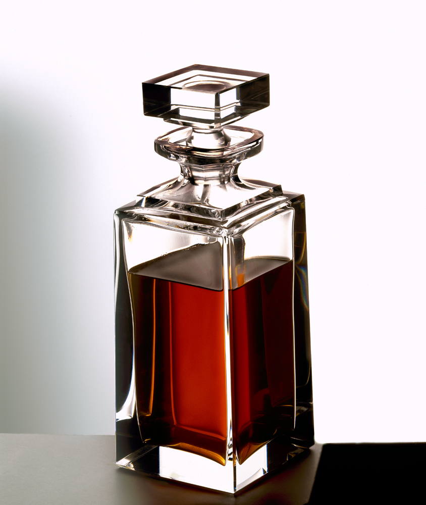 crystal whiskey decanter on a neutral ground