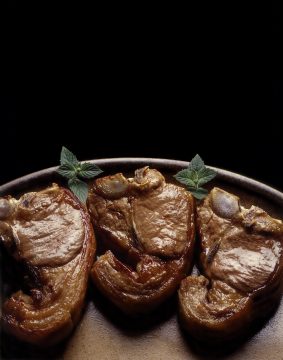 4 lamb chops marinated in olive oil and garic slowly grilled