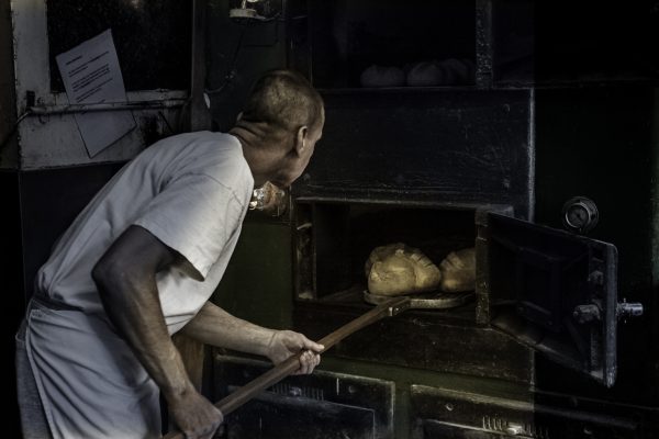 5. extracting breads from oven